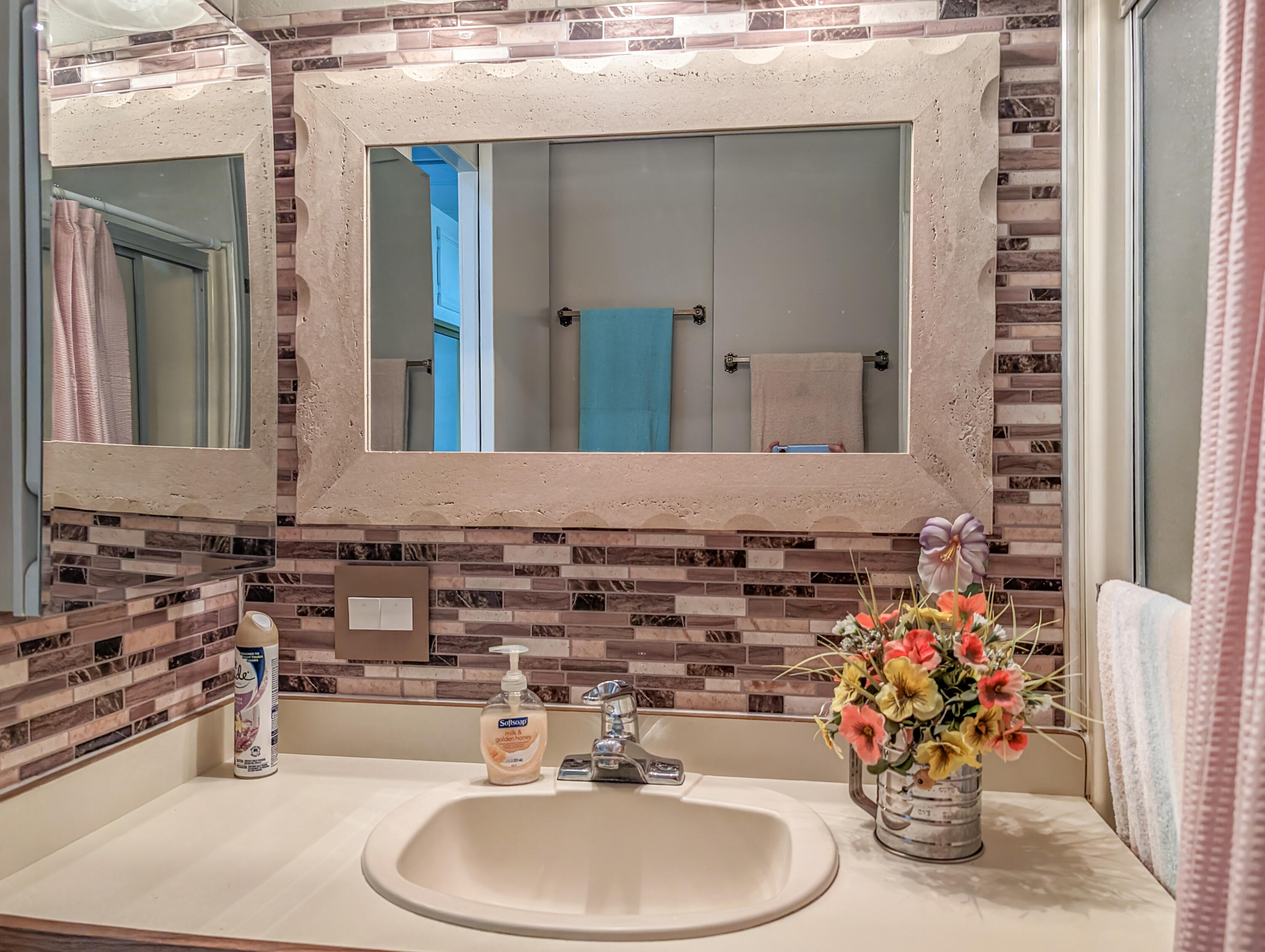 70200 Dillon Road, Unit 111 Desert Hot Springs, CA 92241 - Photo 9 of 25 a bathroom with a sink and a mirror