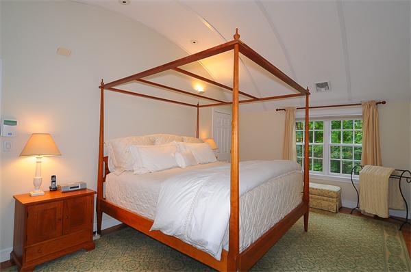 36 Pinecroft Road Weston, MA 02493 - Photo 11 of 19 a bedroom with a bed and a window