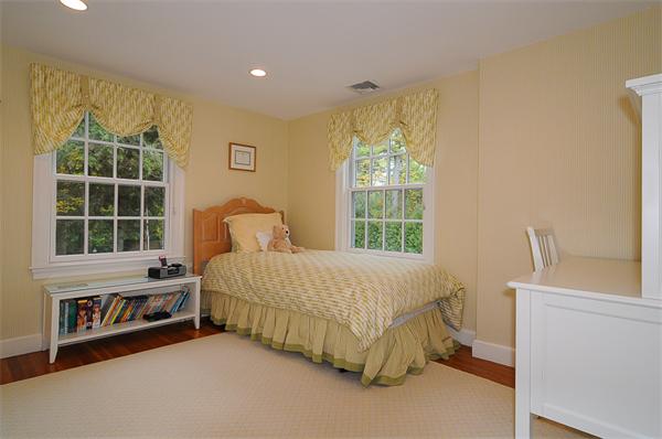 36 Pinecroft Road Weston, MA 02493 - Photo 16 of 19 a bedroom with a bed and a window