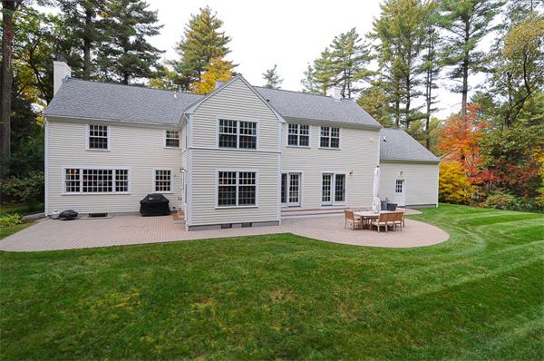 36 Pinecroft Road Weston, MA 02493 - Photo 18 of 19 a front view of a house with a yard and garage