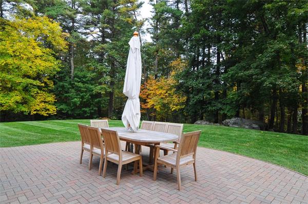 36 Pinecroft Road Weston, MA 02493 - Photo 19 of 19 a view of a patio with a table chairs and a table