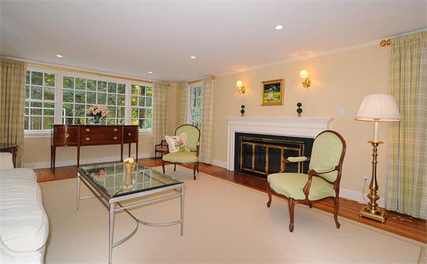 36 Pinecroft Road Weston, MA 02493 - Photo 3 of 19 a living room with furniture a fireplace and a table