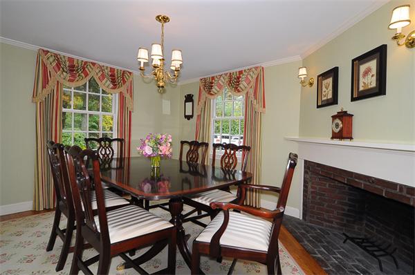 36 Pinecroft Road Weston, MA 02493 - Photo 4 of 19 a view of a dining room with furniture a chandelier and window
