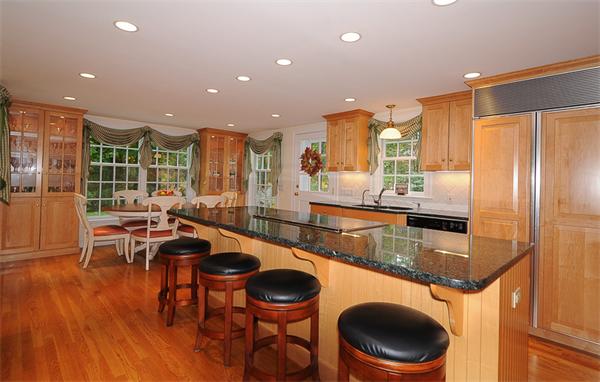 36 Pinecroft Road Weston, MA 02493 - Photo 5 of 19 a kitchen with stainless steel appliances granite countertop a sink a stove and a wooden floors