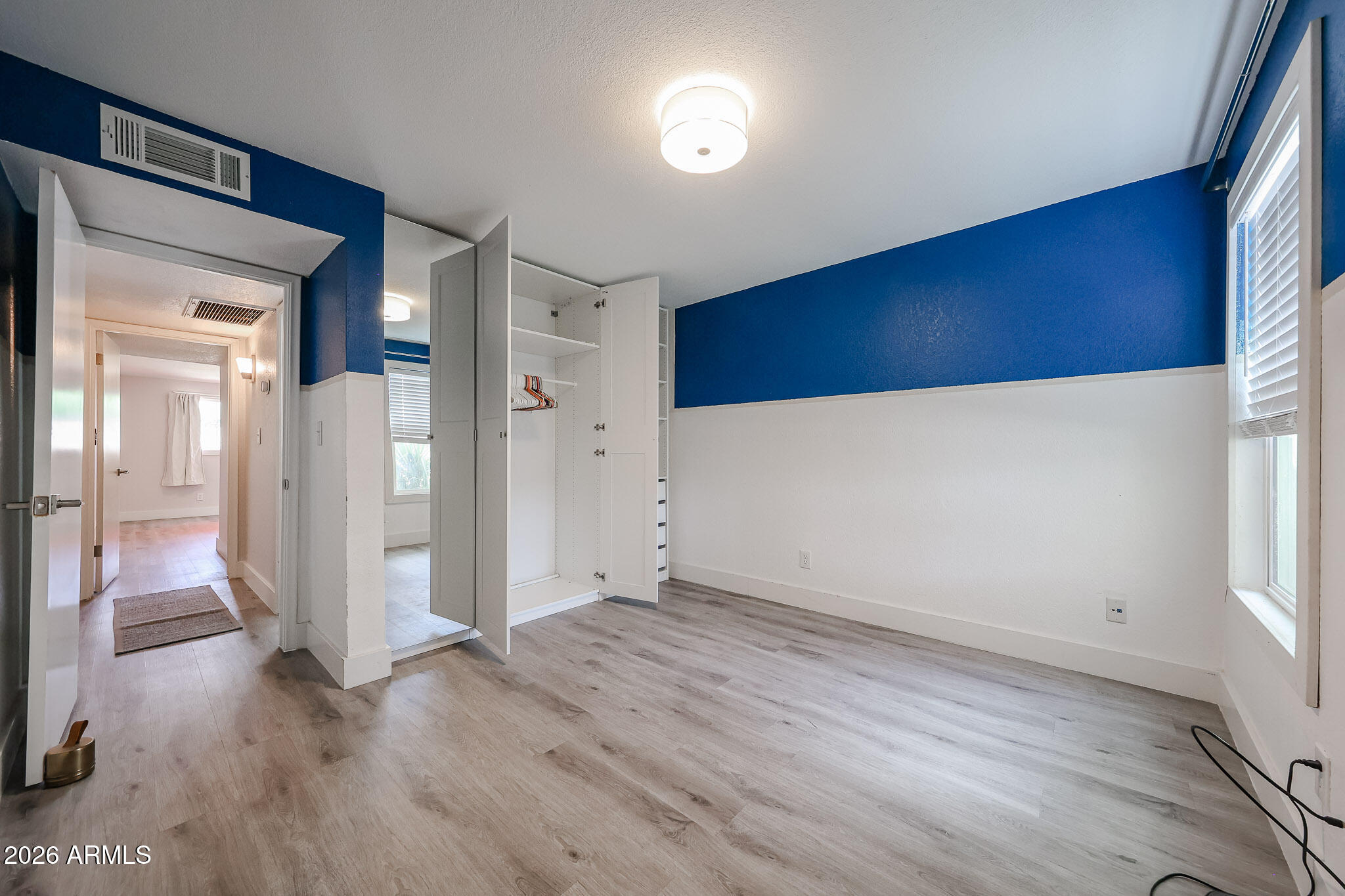 5114 East Monte Vista Road Phoenix, AZ 85008 - Photo 24 of 45 wooden floor in an empty room with a window