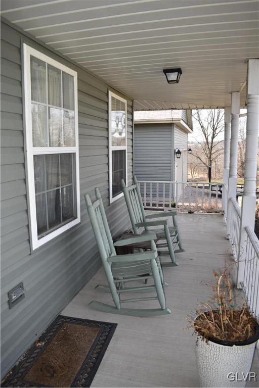 5869 Spangler Road Nazareth, PA 18064 - Photo 11 of 33 a view of a patio with a table and chairs