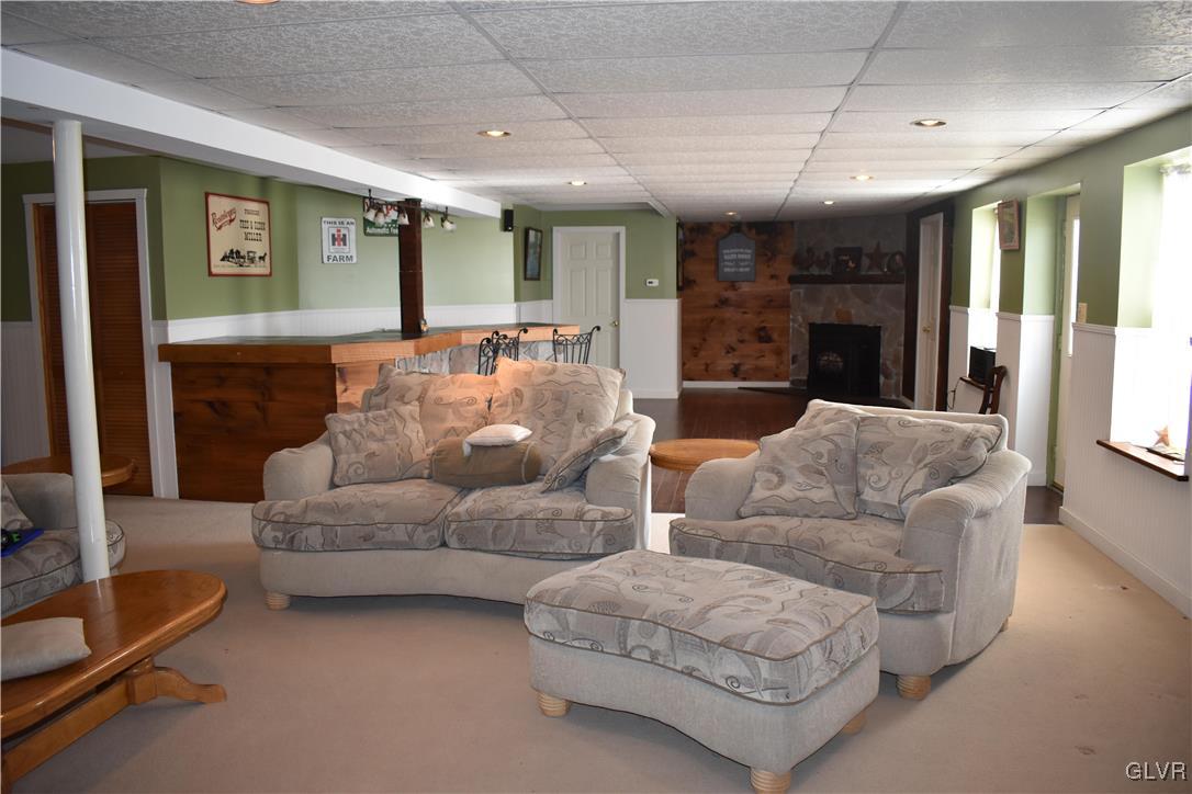 5869 Spangler Road Nazareth, PA 18064 - Photo 18 of 33 a living room with furniture and a flat screen tv