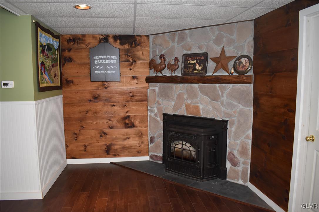 5869 Spangler Road Nazareth, PA 18064 - Photo 22 of 33 a living room with a fireplace and a ceiling fan