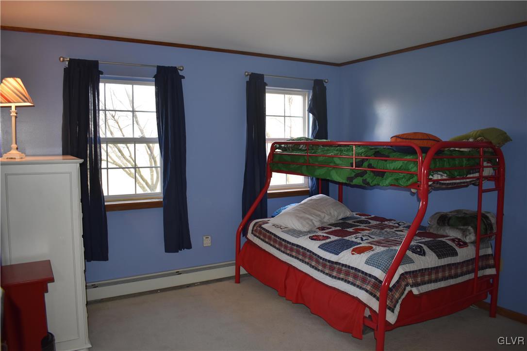 5869 Spangler Road Nazareth, PA 18064 - Photo 29 of 33 a bed sitting in a bedroom next to a window