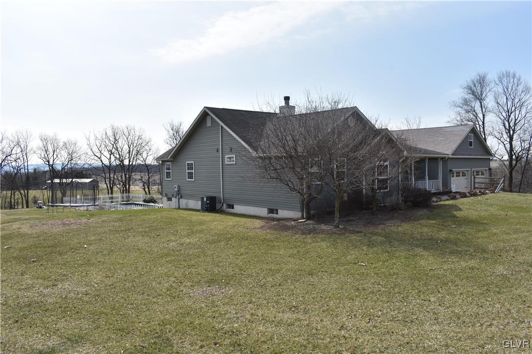 5869 Spangler Road Nazareth, PA 18064 - Photo 8 of 33 a view of a house with a yard
