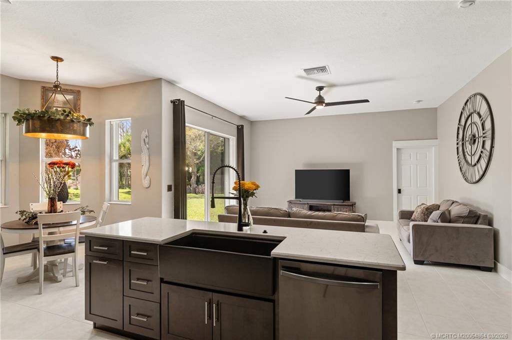 2072 Southeast Hanford Road Port St. Lucie, FL 34952 - Photo 13 of 58 a living room with furniture and a flat screen tv