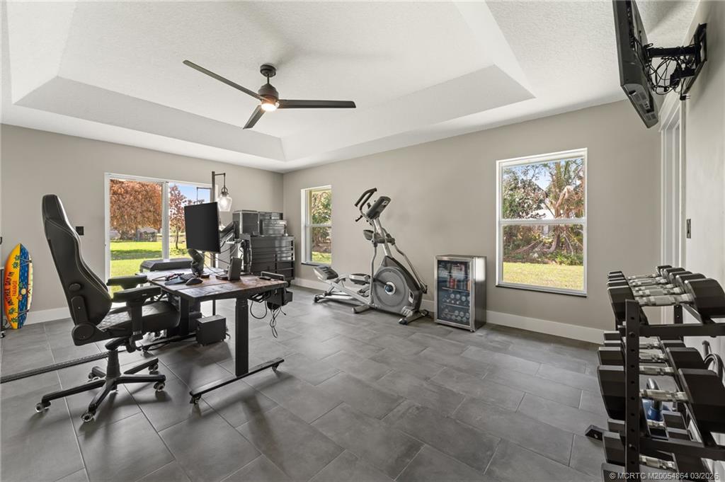 2072 Southeast Hanford Road Port St. Lucie, FL 34952 - Photo 34 of 58 a view of a workspace with furniture and a window