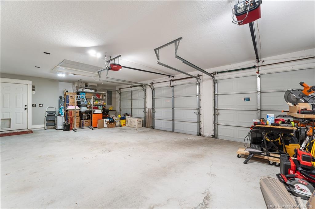 2072 Southeast Hanford Road Port St. Lucie, FL 34952 - Photo 45 of 58 a view of a garage with a bike and storage