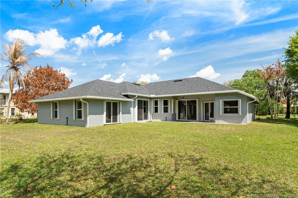 2072 Southeast Hanford Road Port St. Lucie, FL 34952 - Photo 46 of 58 a front view of a house with a garden