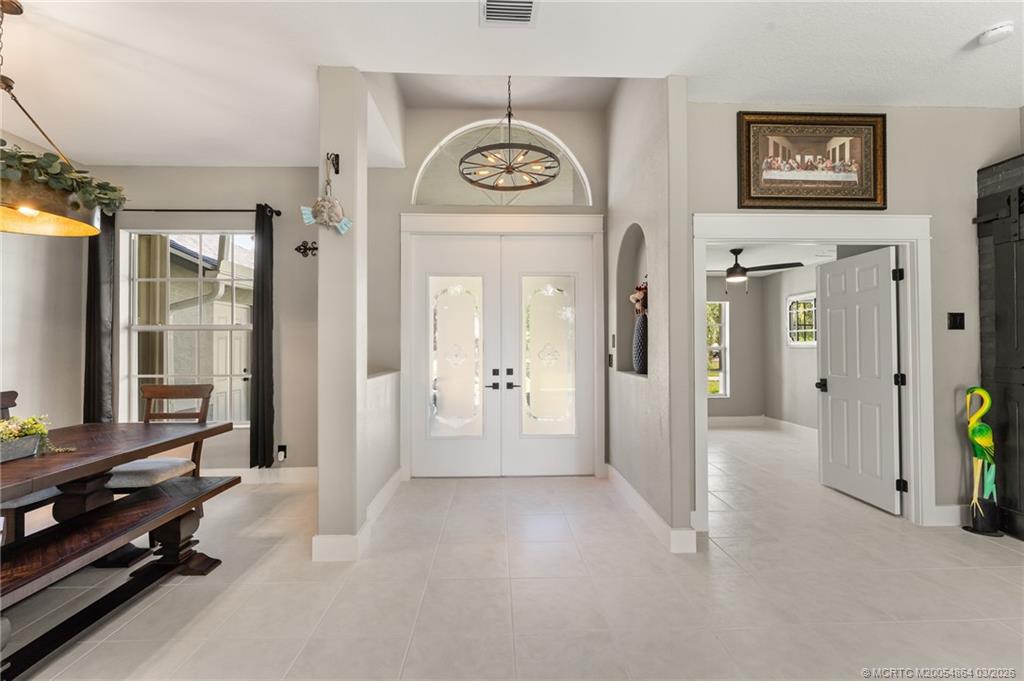 2072 Southeast Hanford Road Port St. Lucie, FL 34952 - Photo 6 of 58 a view of a hallway with interior of the house
