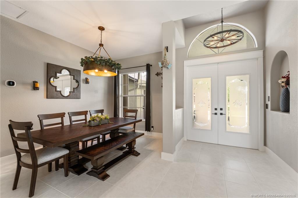 2072 Southeast Hanford Road Port St. Lucie, FL 34952 - Photo 7 of 58 a dining room with furniture and window