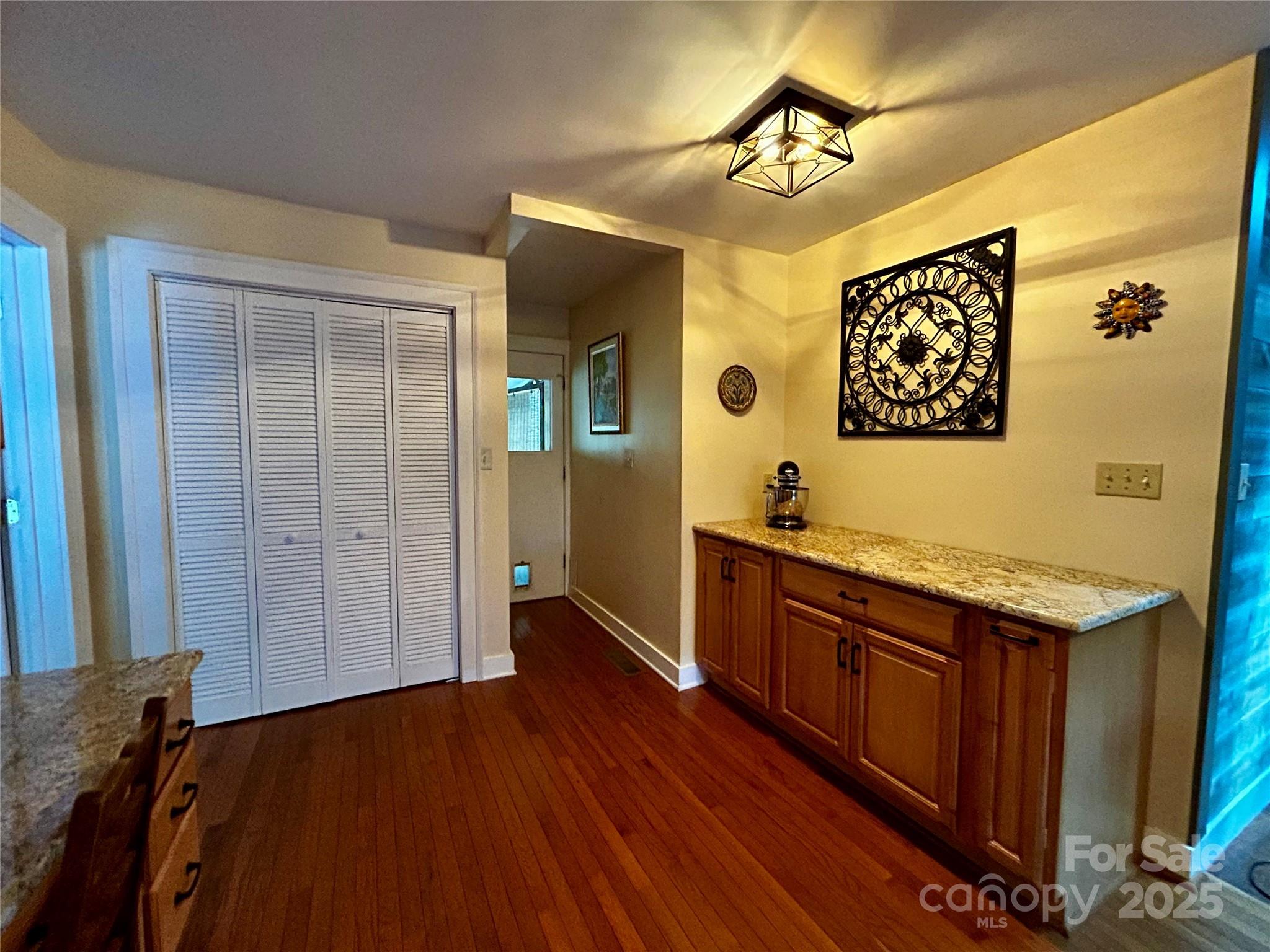 283 Bull Creek Road Asheville, NC 28805 - Photo 11 of 35 a view of a kitchen cabinets a sink and wooden floor