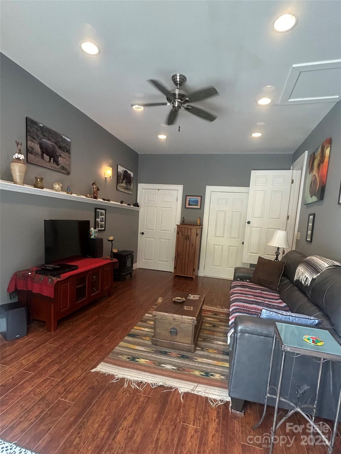 283 Bull Creek Road Asheville, NC 28805 - Photo 13 of 35 a living room with furniture and a flat screen tv