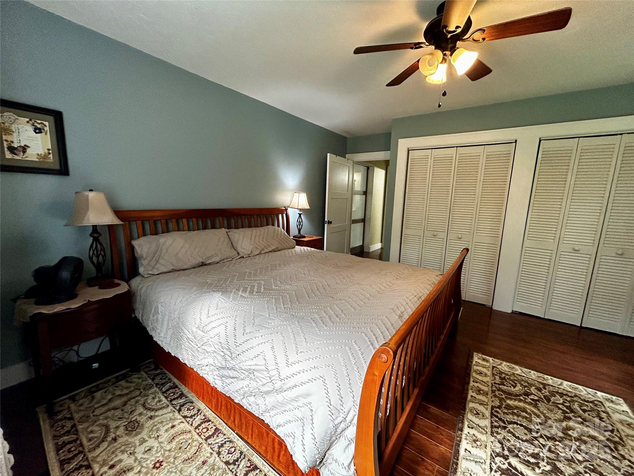 283 Bull Creek Road Asheville, NC 28805 - Photo 15 of 35 a bedroom with a bed and wooden floor