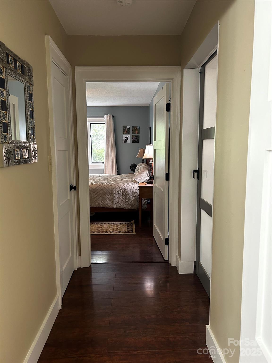 283 Bull Creek Road Asheville, NC 28805 - Photo 20 of 35 a view of a livingroom from a hallway