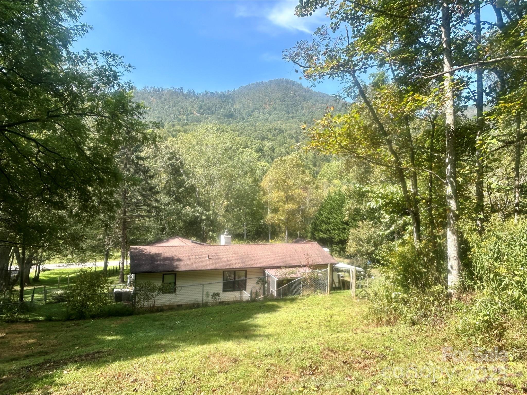 283 Bull Creek Road Asheville, NC 28805 - Photo 26 of 35 a view of a lake with a mountain