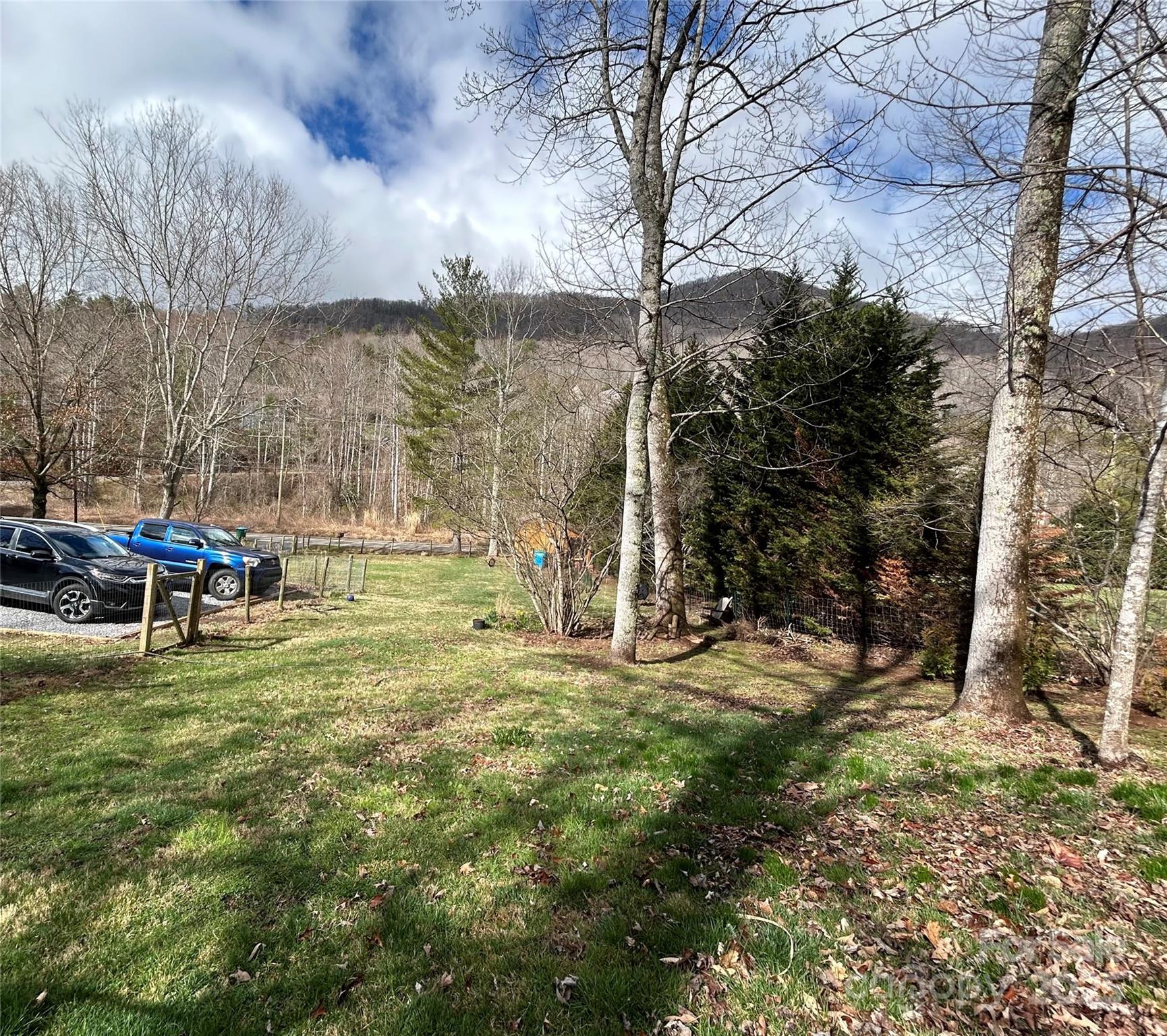 283 Bull Creek Road Asheville, NC 28805 - Photo 28 of 35 a swimming pool with outdoor seating and yard