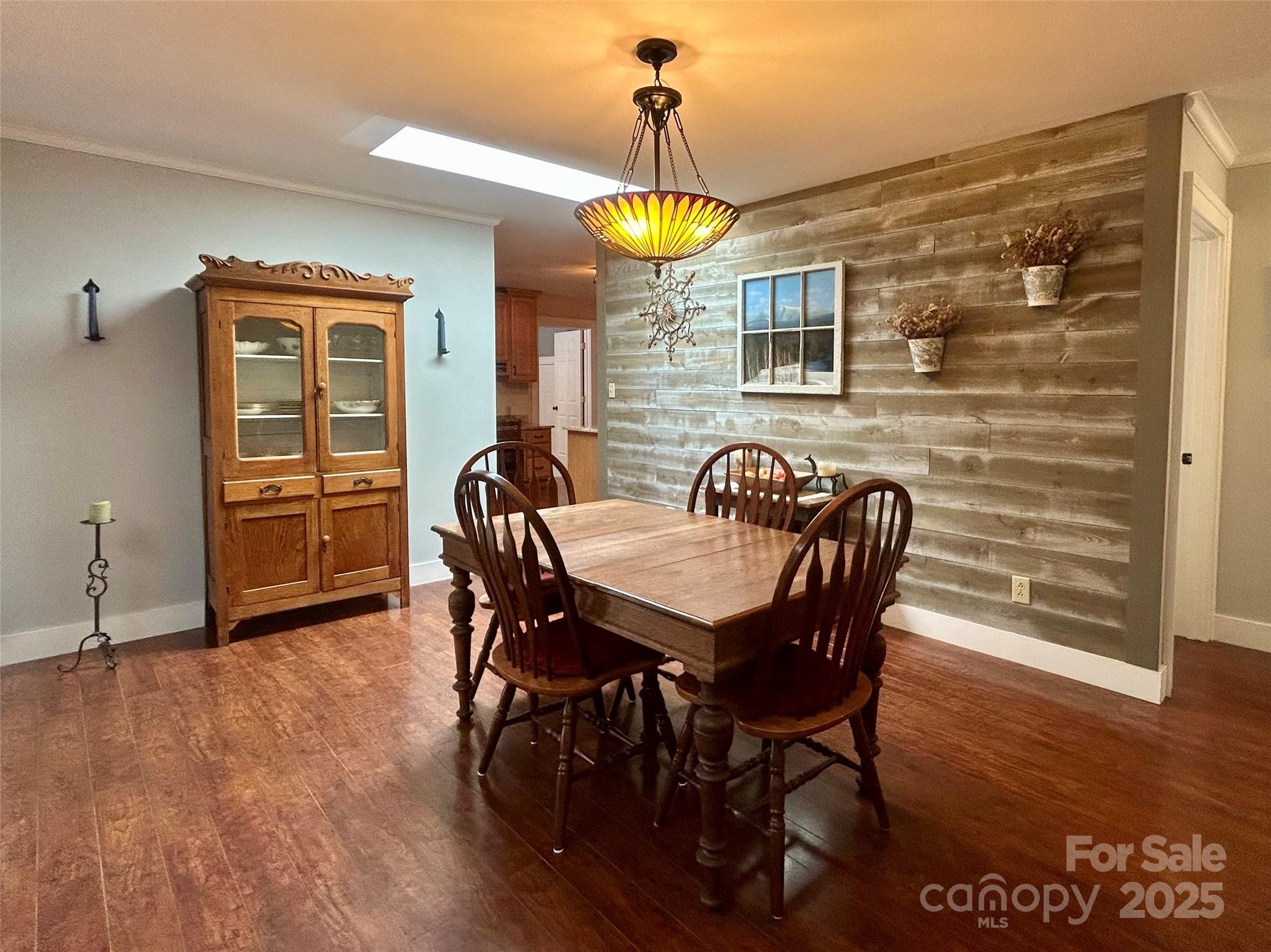 283 Bull Creek Road Asheville, NC 28805 - Photo 5 of 35 a view of a dining room with furniture and wooden floor