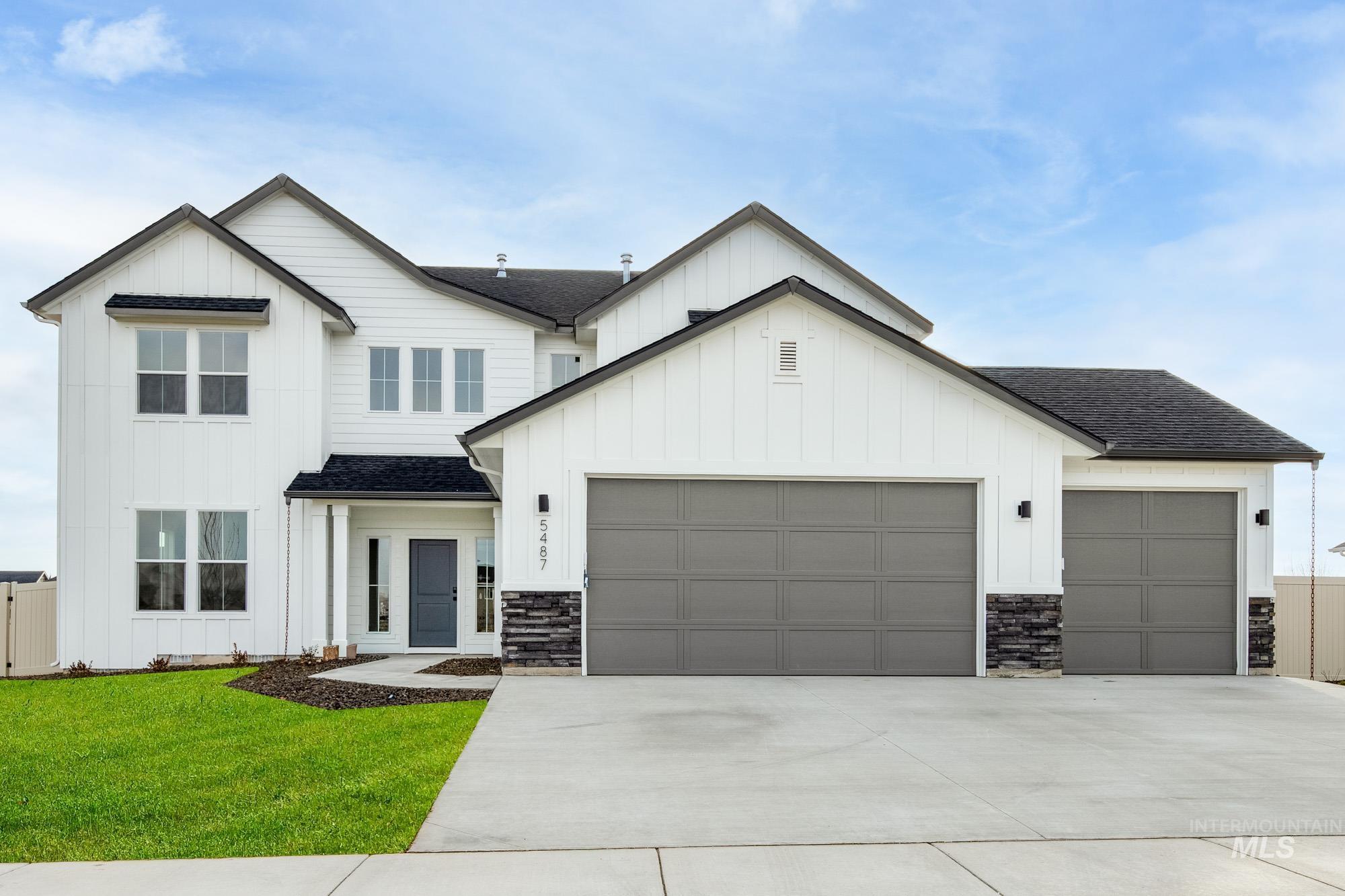 Modern farmhouse with board and batten siding and roof with shingles