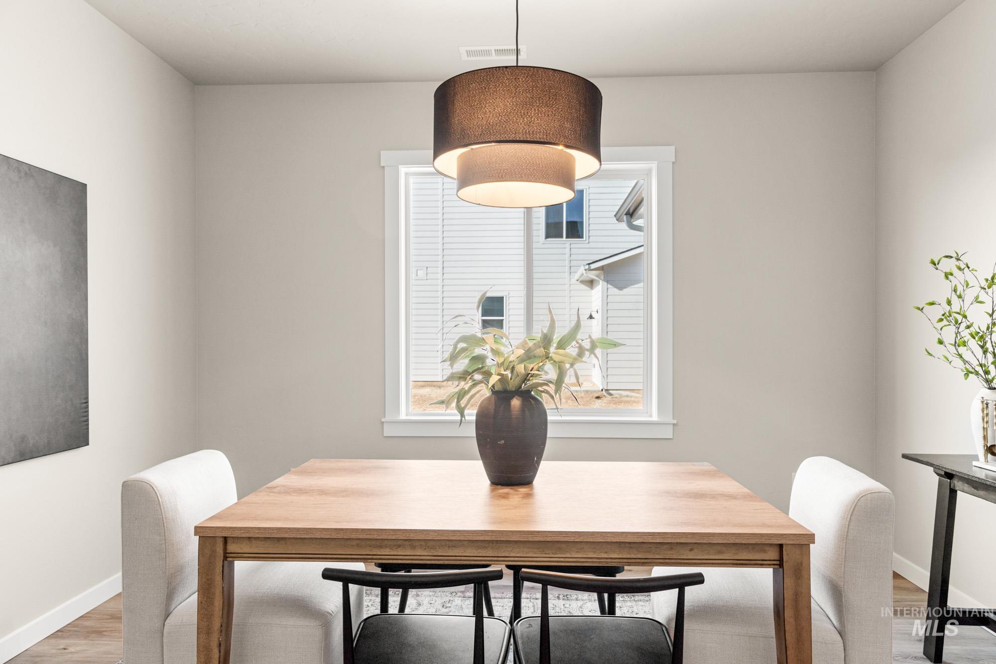 5487 West Yarnell Street Eagle, ID 83616 - Photo 2 of 30 Dining space featuring light wood finished floors and baseboards