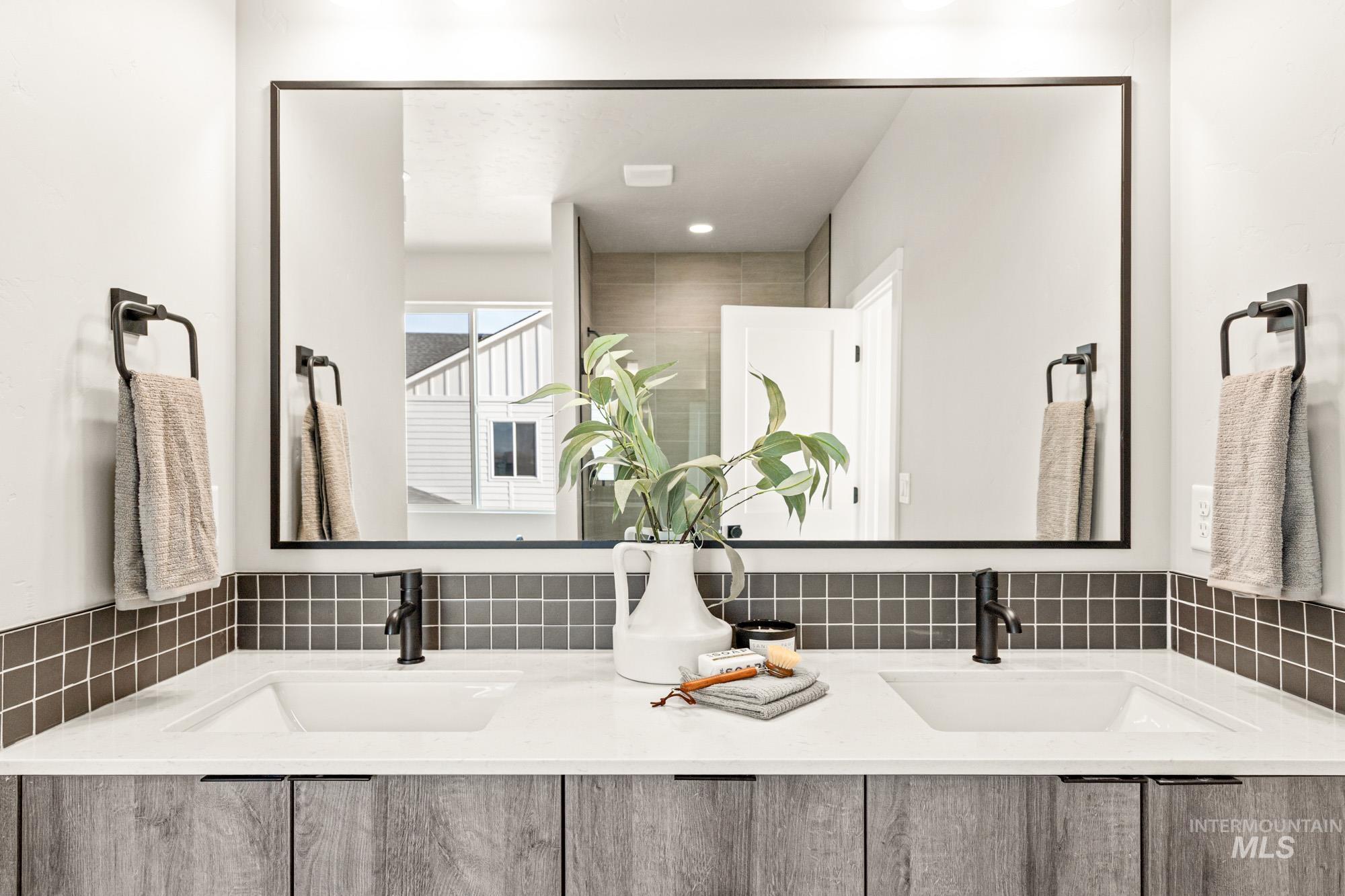 5487 West Yarnell Street Eagle, ID 83616 - Photo 23 of 30 Bathroom featuring double vanity and a shower with shower door