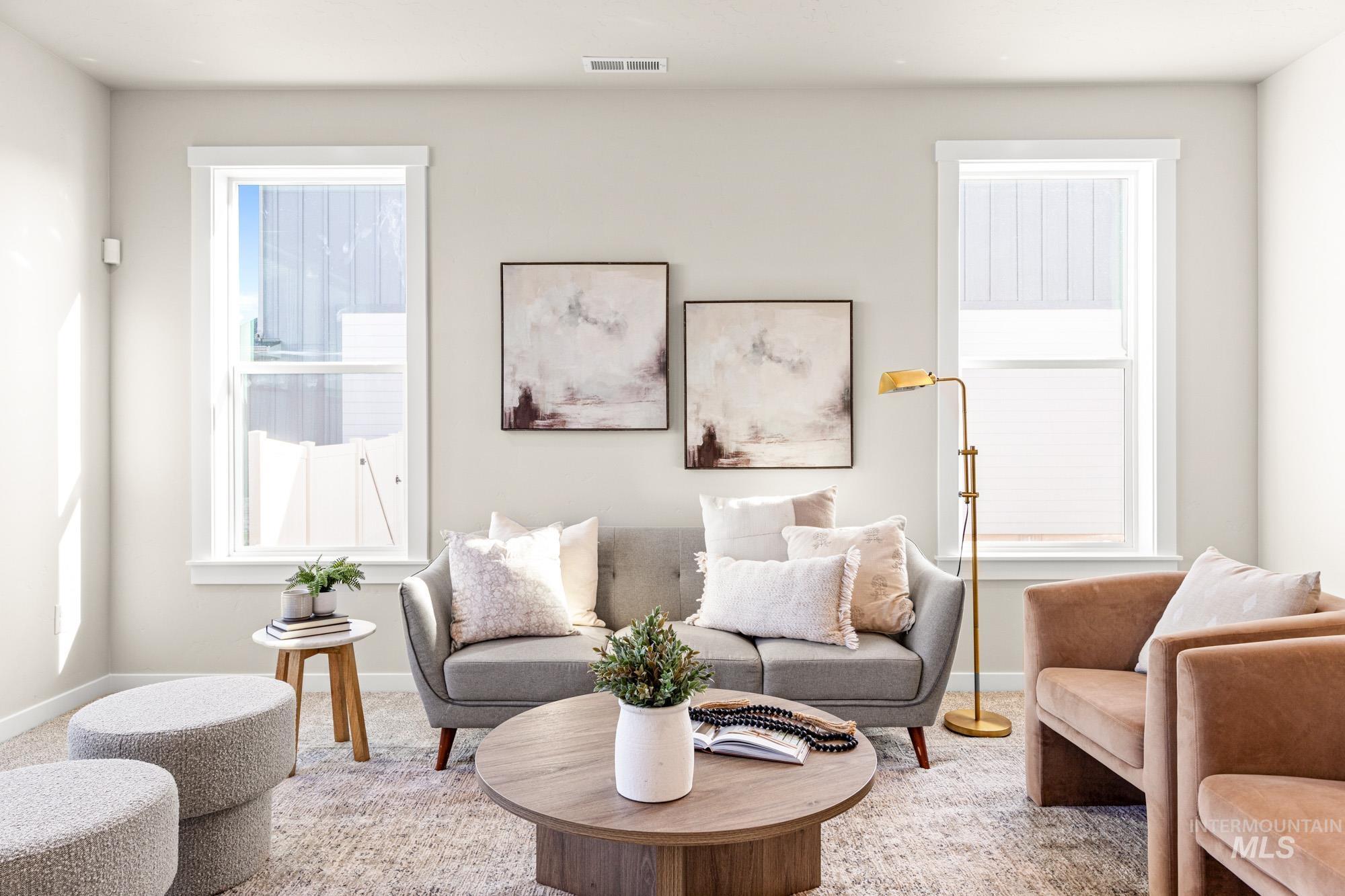 5487 West Yarnell Street Eagle, ID 83616 - Photo 3 of 30 Living room featuring baseboards and carpet