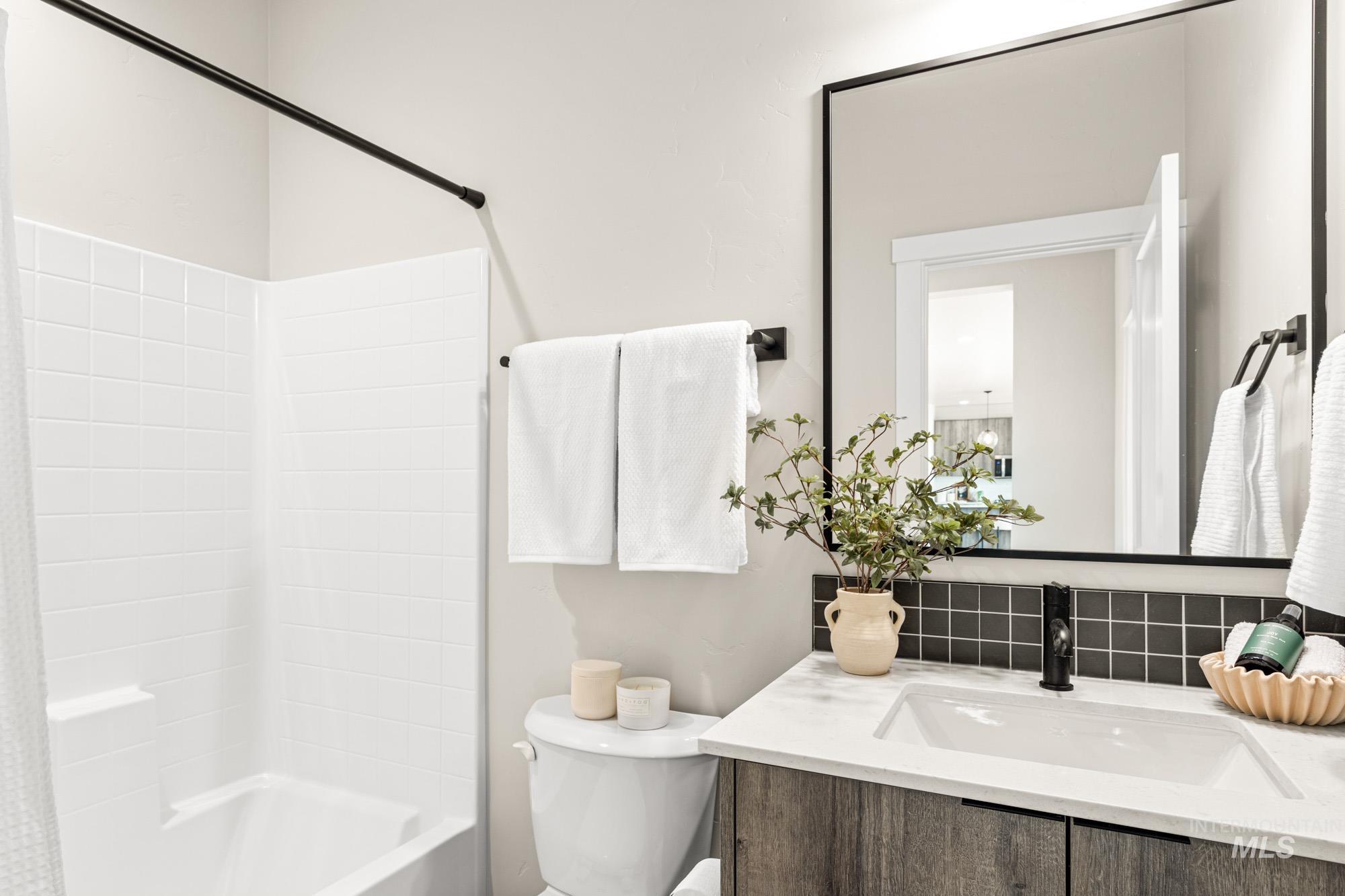5487 West Yarnell Street Eagle, ID 83616 - Photo 6 of 30 Full bathroom with shower / bathtub combination with curtain and vanity