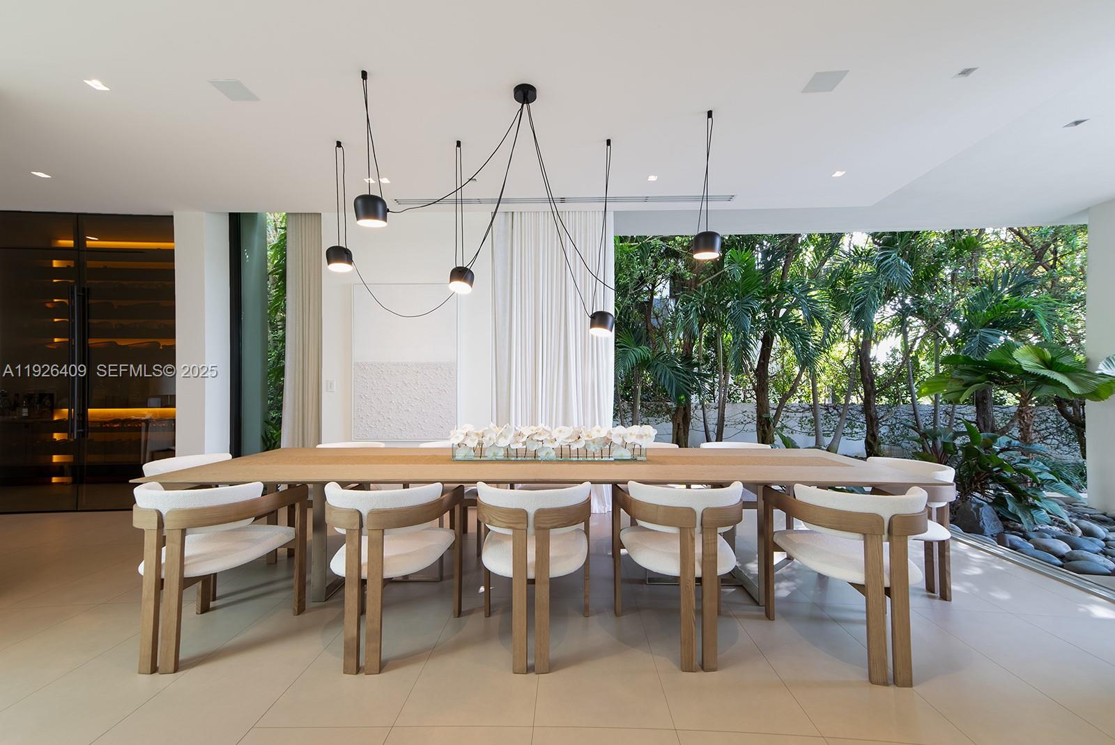6480 Allison Road Miami Beach, FL 33141 - Photo 13 of 66 a view of a dining room with furniture window and outside view