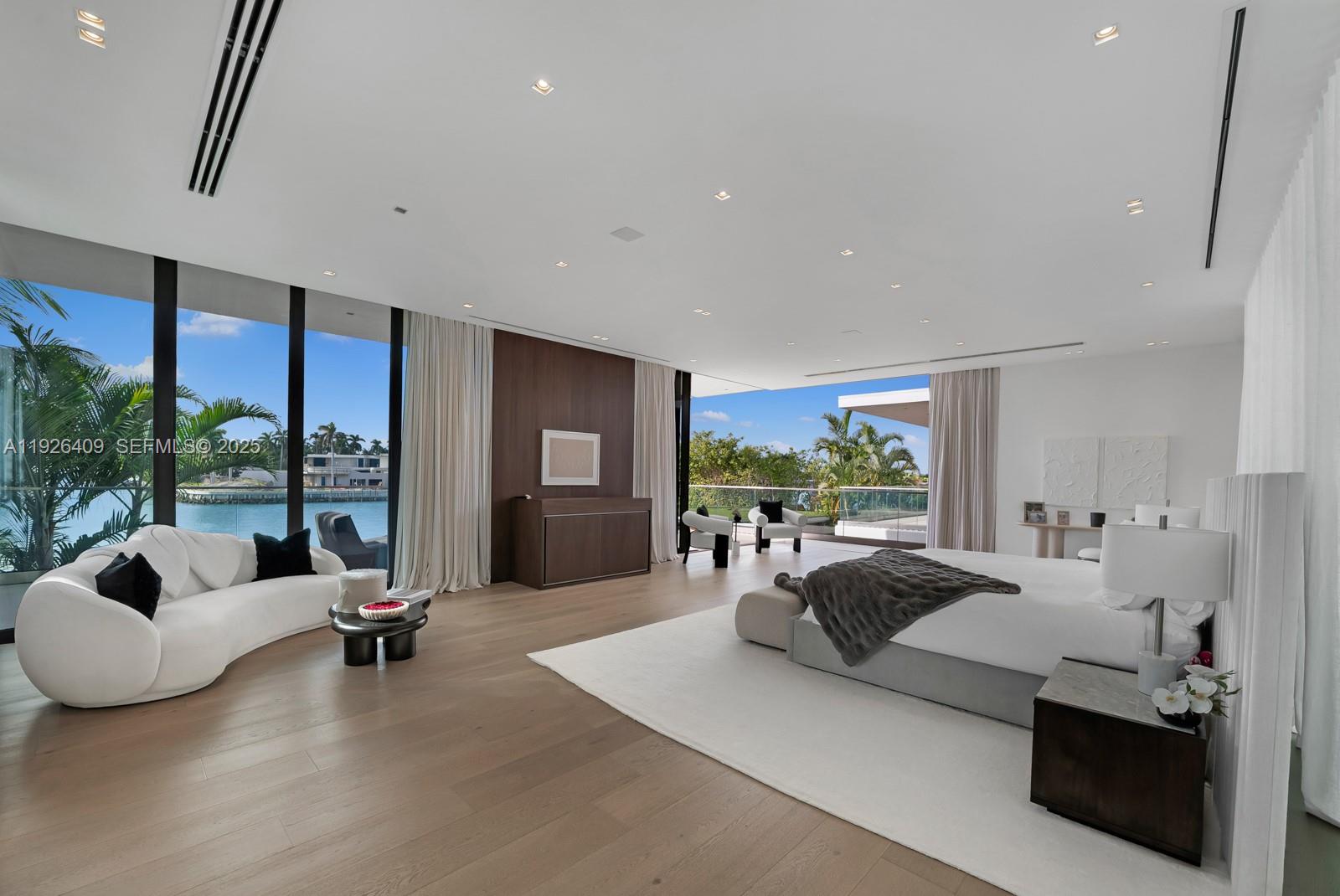 6480 Allison Road Miami Beach, FL 33141 - Photo 16 of 66 a living room with furniture and a large window