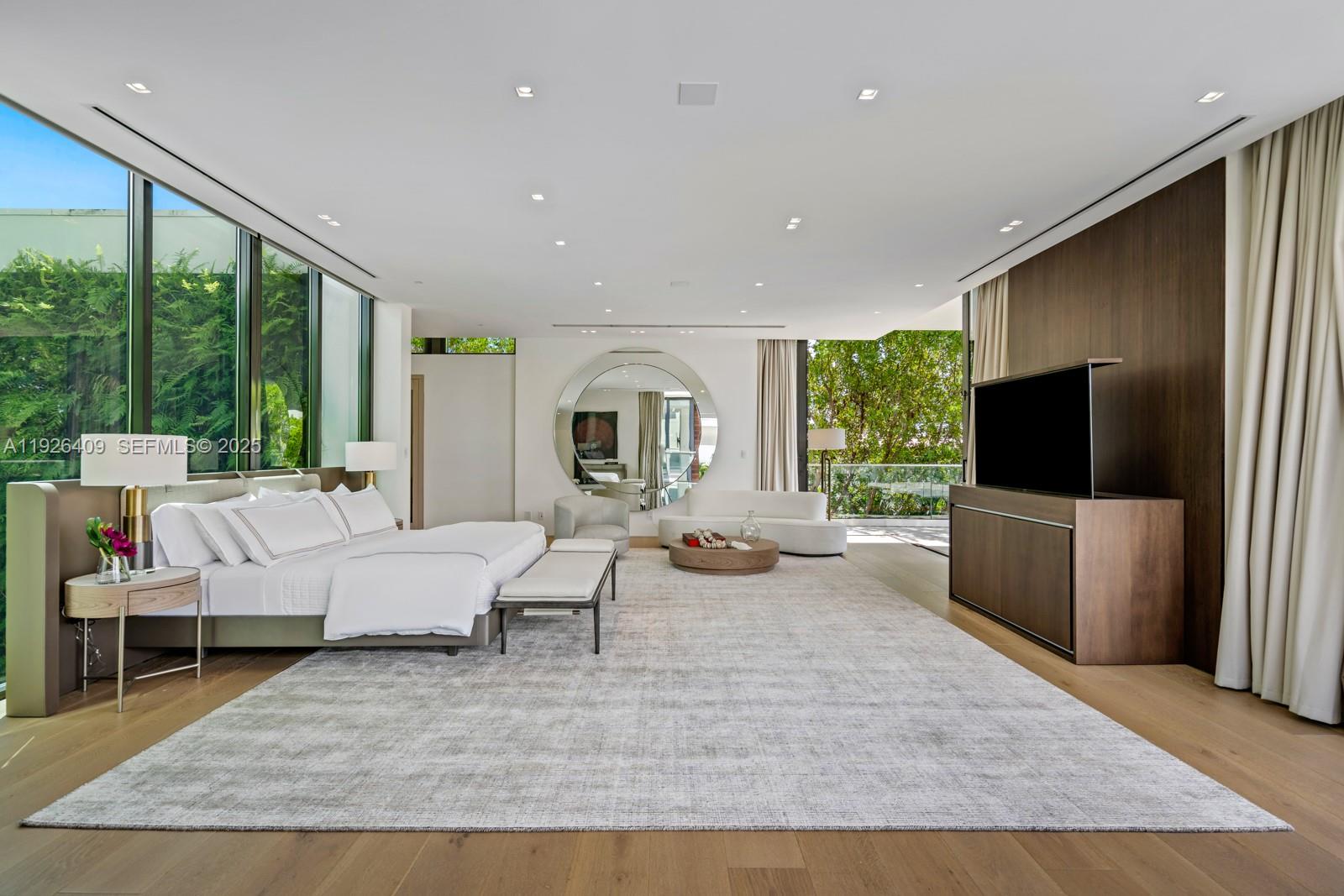 6480 Allison Road Miami Beach, FL 33141 - Photo 17 of 66 a living room with furniture large window and a flat screen tv