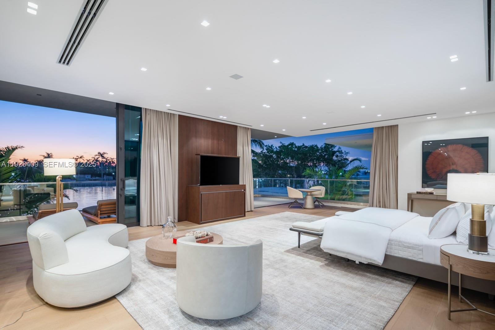 6480 Allison Road Miami Beach, FL 33141 - Photo 18 of 66 a living room with patio furniture and a flat screen tv