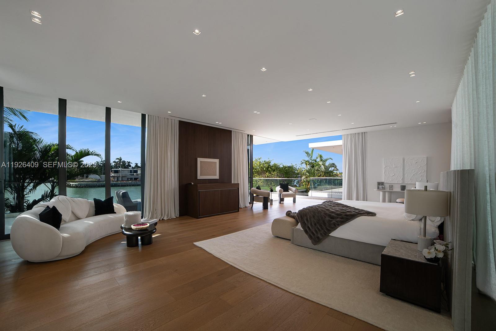 6480 Allison Road Miami Beach, FL 33141 - Photo 19 of 66 a living room with furniture and a large window
