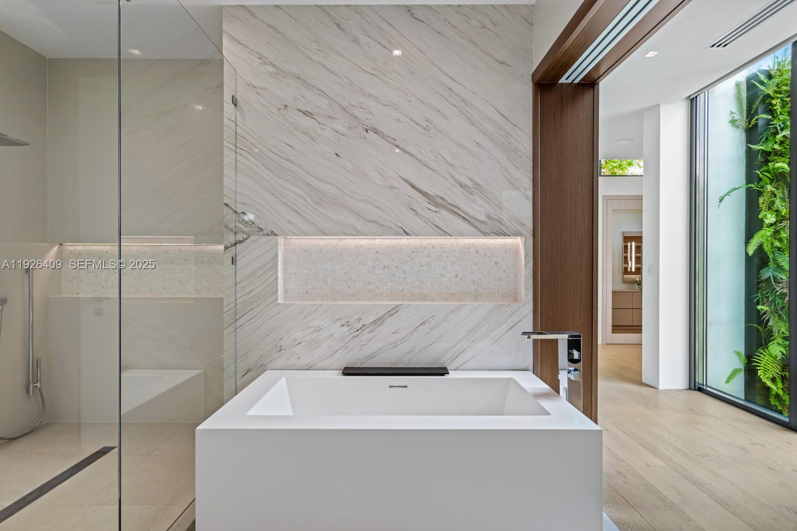 6480 Allison Road Miami Beach, FL 33141 - Photo 21 of 66 a bathroom with a sink and shower