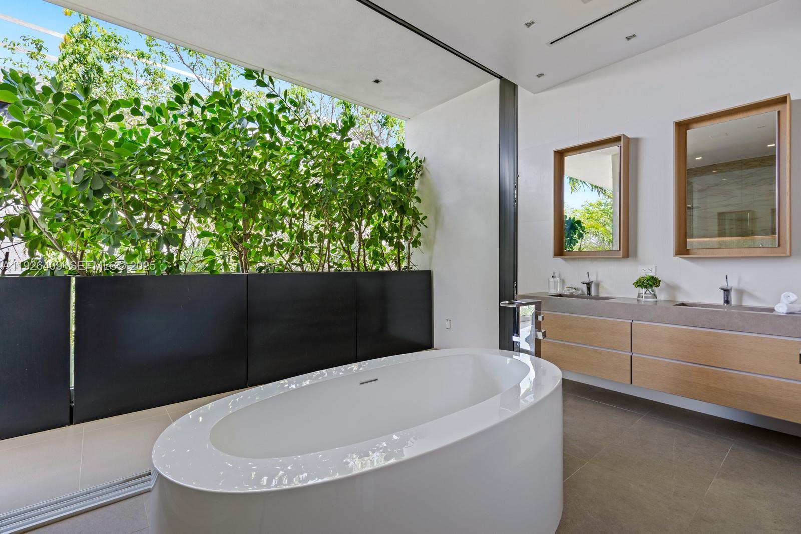 6480 Allison Road Miami Beach, FL 33141 - Photo 29 of 66 a bathroom with a bathtub and sink