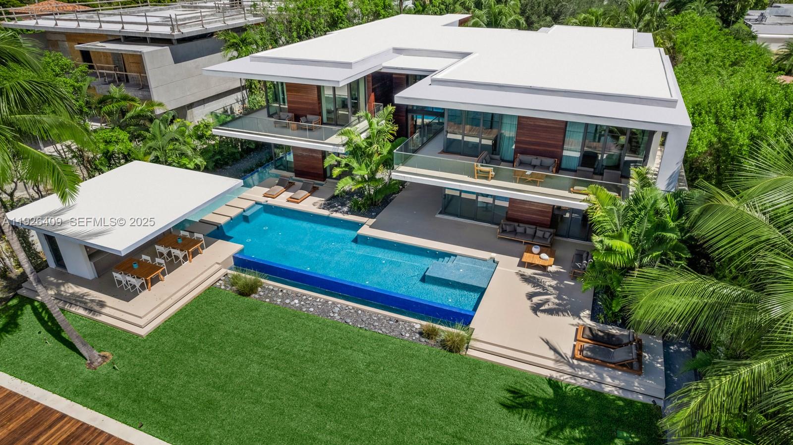 6480 Allison Road Miami Beach, FL 33141 - Photo 35 of 66 aerial view of a house with a yard table and chairs