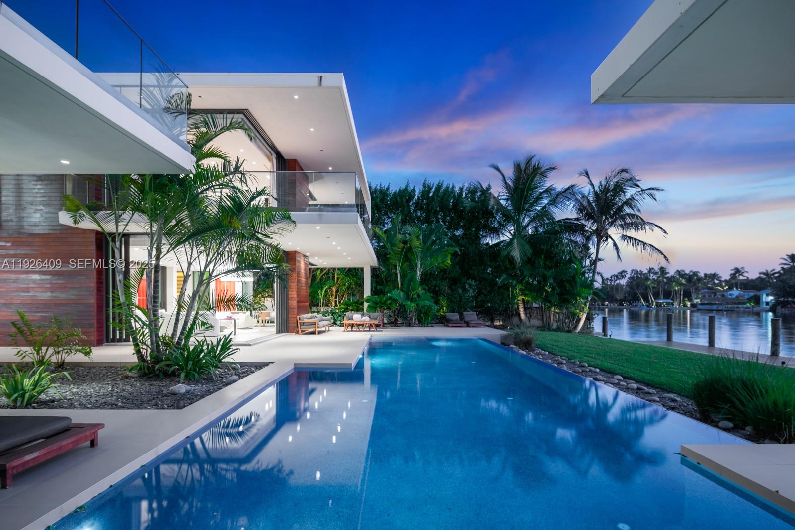 6480 Allison Road Miami Beach, FL 33141 - Photo 41 of 66 a front view of a house with yard and green space