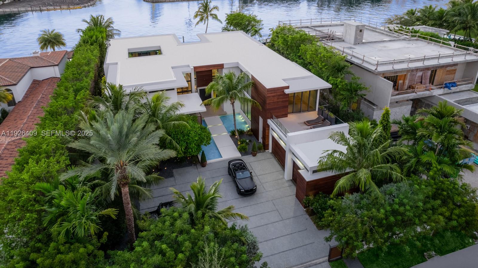 6480 Allison Road Miami Beach, FL 33141 - Photo 50 of 66 an aerial view of multiple houses with yard