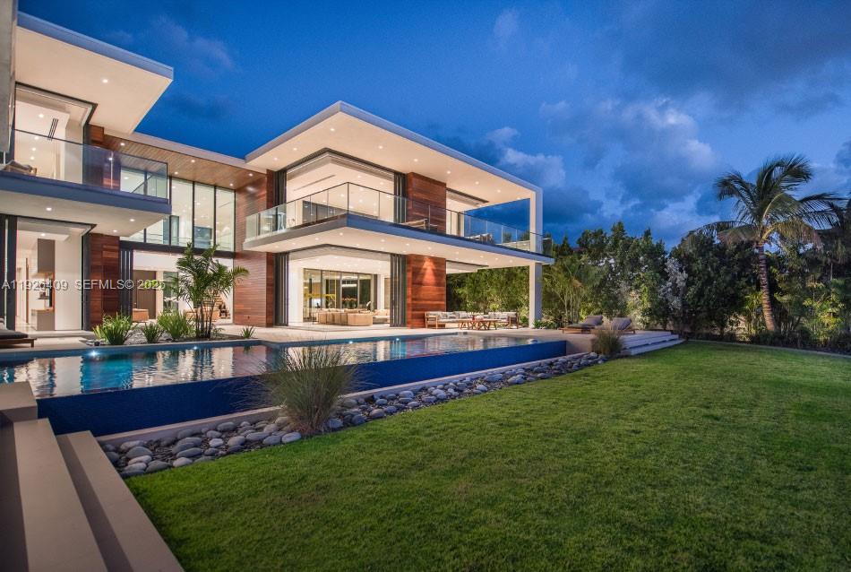 6480 Allison Road Miami Beach, FL 33141 - Photo 51 of 66 a front view of house with yard and outdoor seating