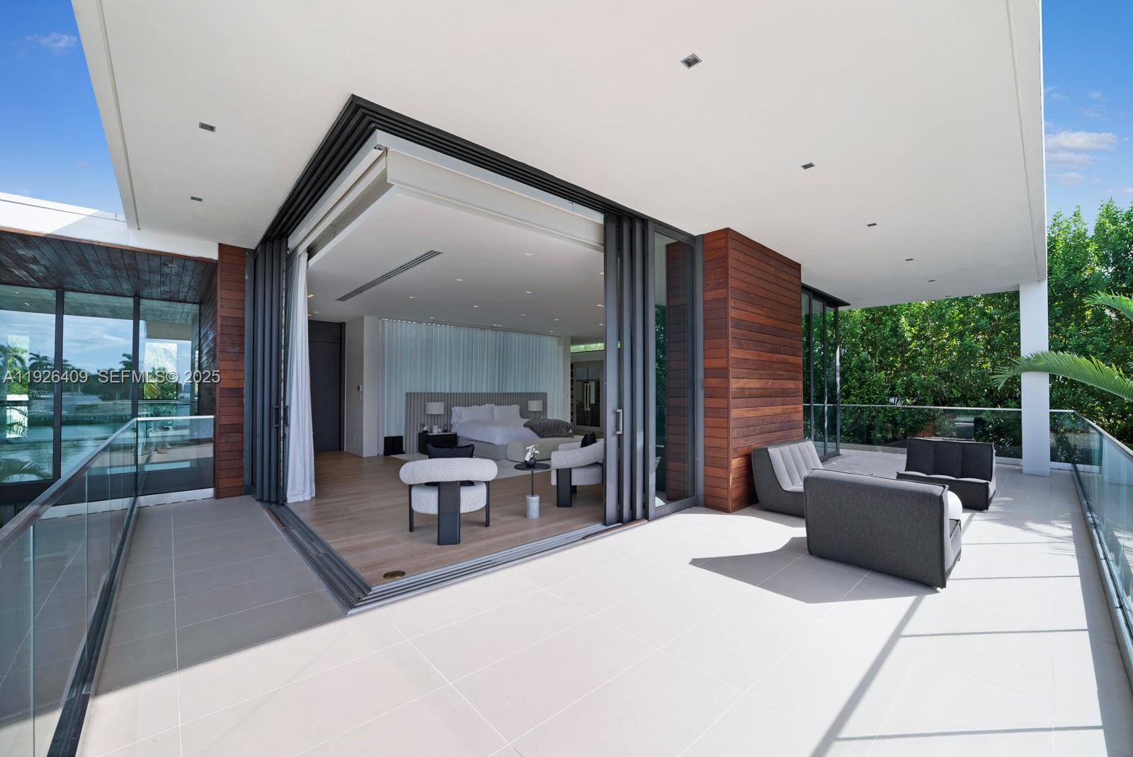 6480 Allison Road Miami Beach, FL 33141 - Photo 52 of 66 a living room with furniture and a large window