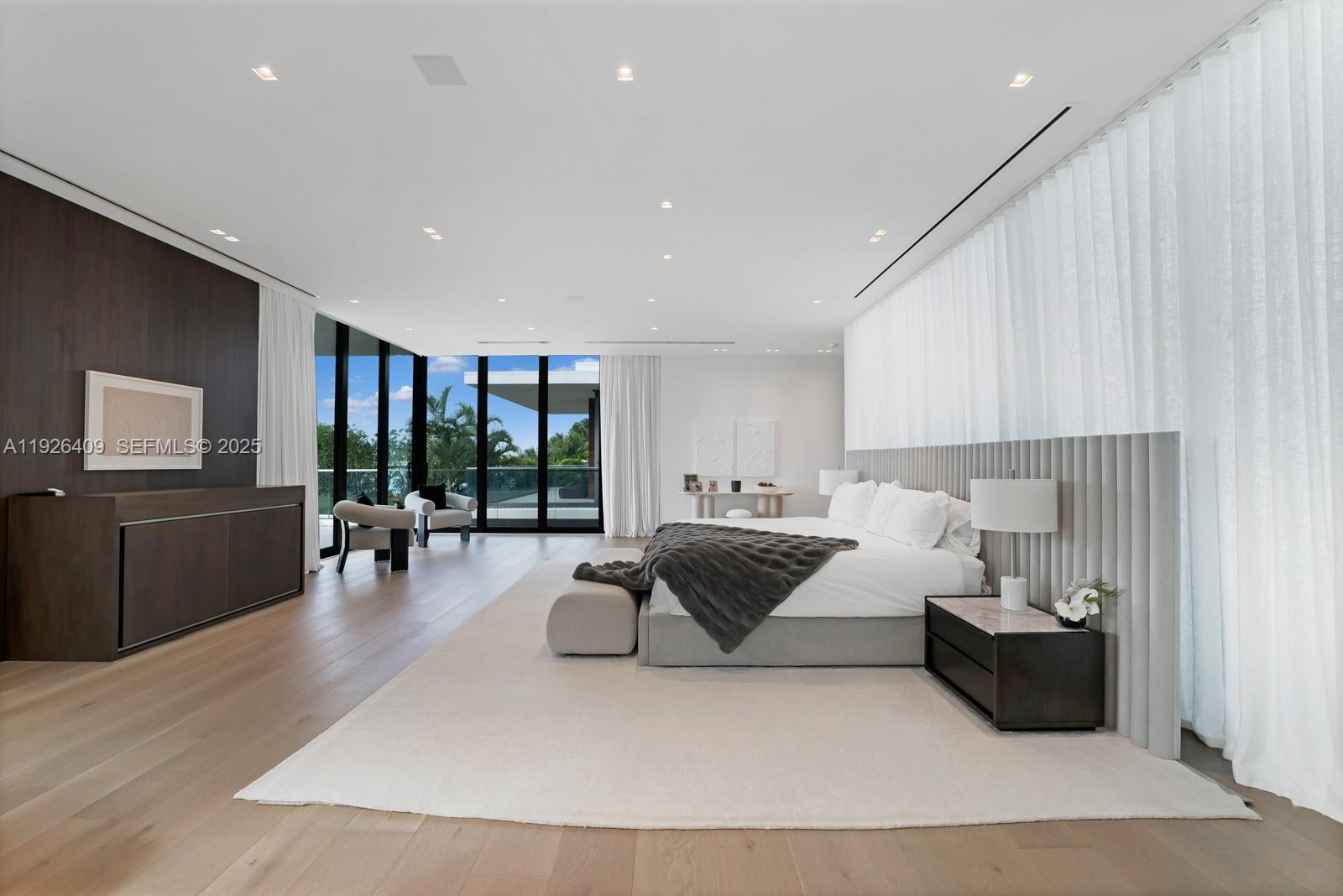 6480 Allison Road Miami Beach, FL 33141 - Photo 58 of 66 a living room with furniture and a flat screen tv