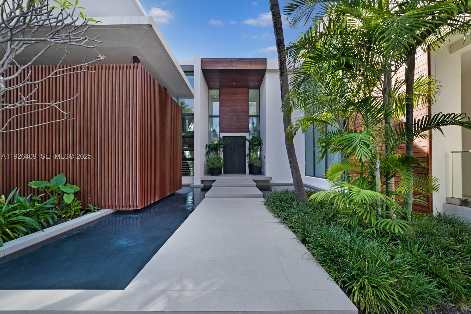 6480 Allison Road Miami Beach, FL 33141 - Photo 61 of 66 a view of a entrance gate of the house