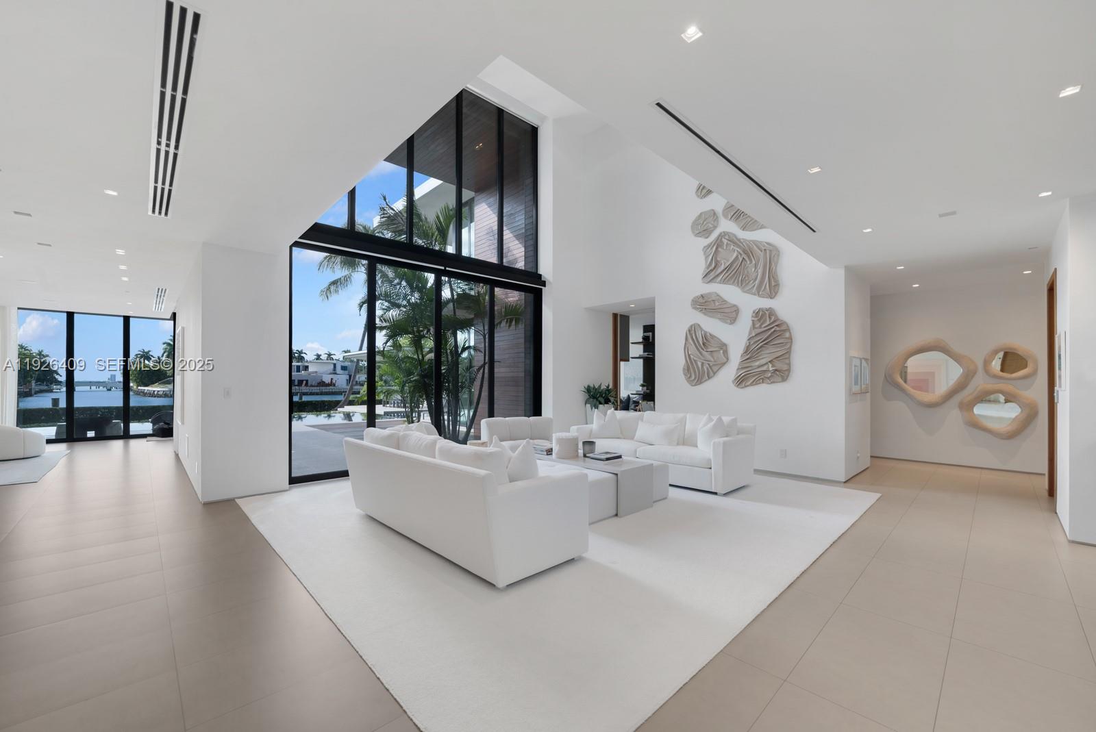 6480 Allison Road Miami Beach, FL 33141 - Photo 8 of 66 a living room with furniture and wooden floor