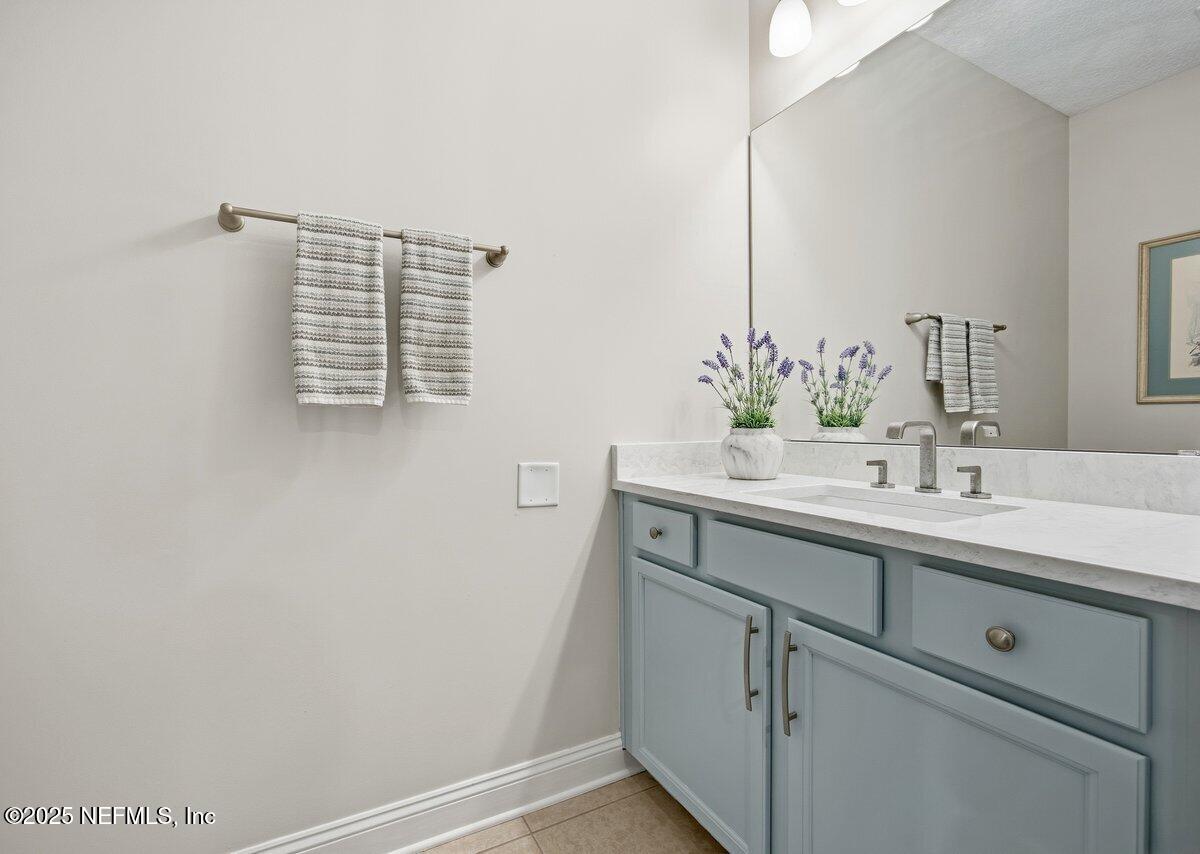 75 Myrtle Park Point Ponte Vedra, FL 32081 - Photo 19 of 38 a bathroom with a sink and a mirror