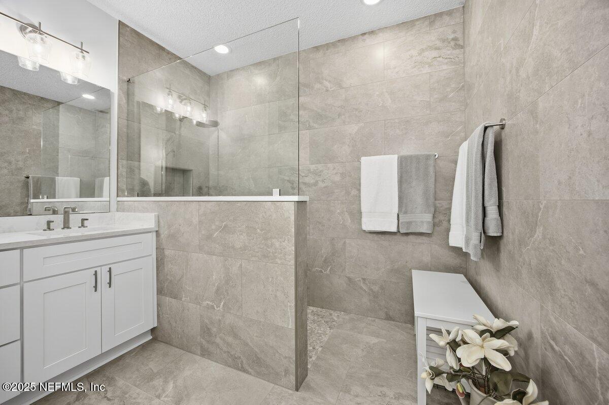 75 Myrtle Park Point Ponte Vedra, FL 32081 - Photo 20 of 38 a bathroom with a sink and a mirror