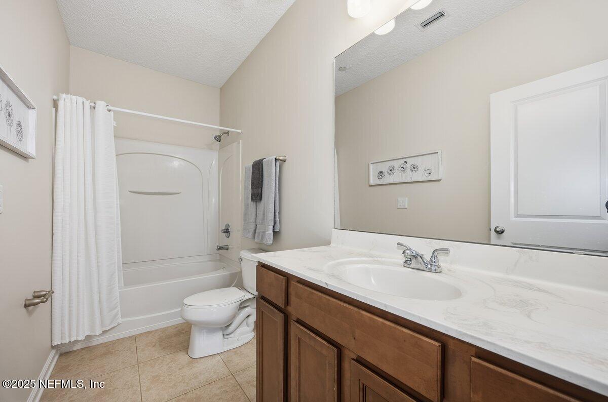 75 Myrtle Park Point Ponte Vedra, FL 32081 - Photo 31 of 38 a bathroom with a sink a toilet and shower